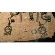 Belt hooks, bronze, three-point swastika inside a circle